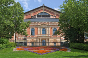Festspielhaus_Bayreuth This photo appears to show the Bayreuth Festspielhaus on a sunny summer day.